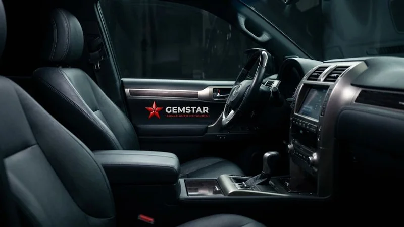 Interior of a clean and freshly detailed luxury SUV showing conditioned leather seats and spotless dashboard surfaces