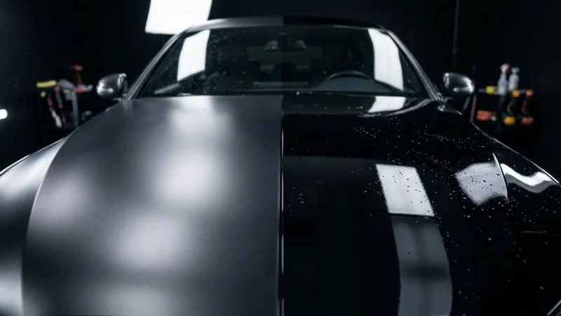 Side-by-side demonstration showing paint protection film on one panel and ceramic coating on another panel of the same vehicle